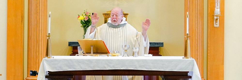 Father Stan at the front of chapel